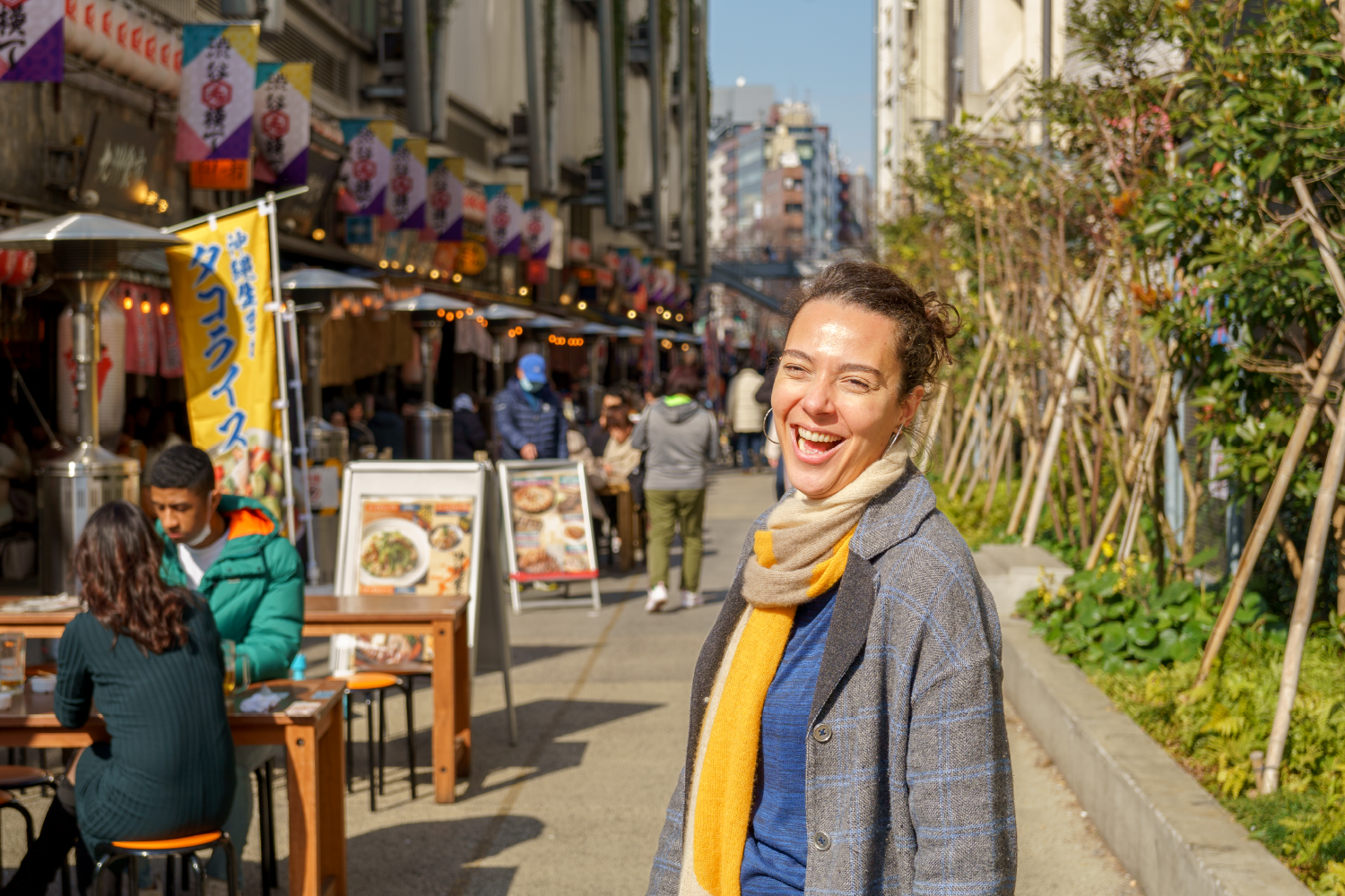 Street portrait of a woman in the izakaya alley of Miyashita Park.
