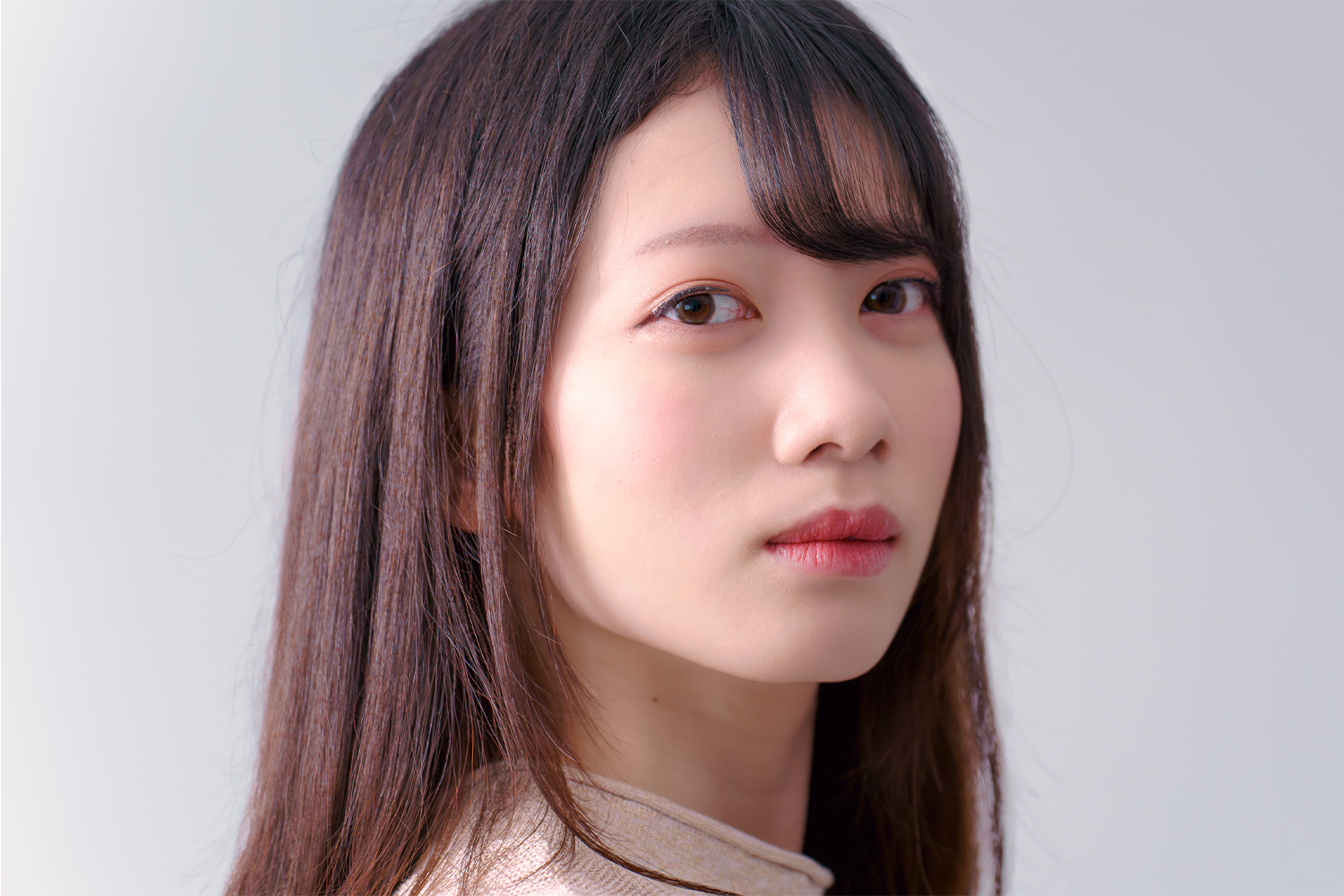 Casting headshot of a Japanese model.