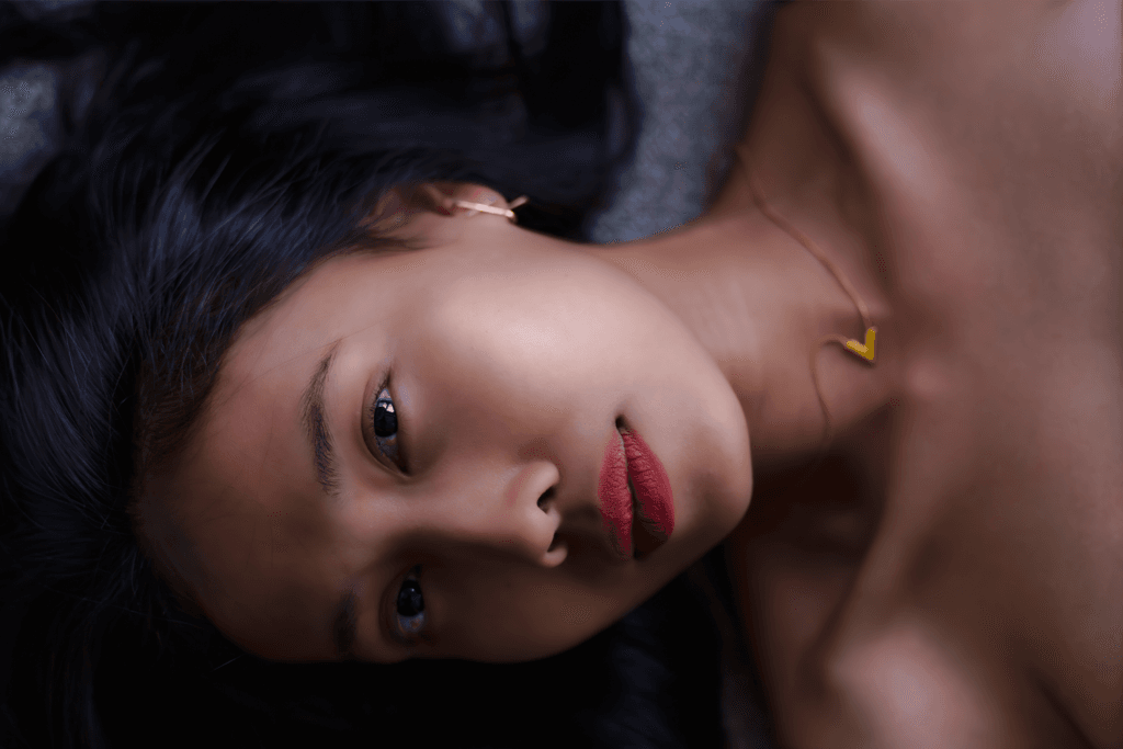 Intimate close-up portrait of a woman lying on a couch