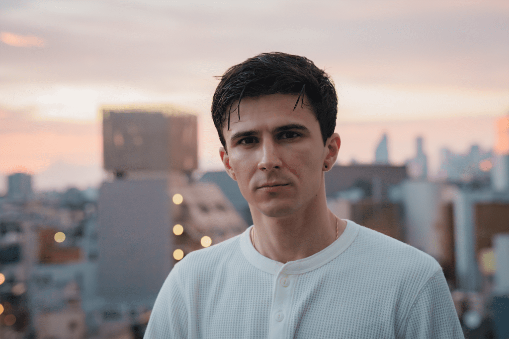 Portrait of a man on JG Studio's balcony at the golden hour