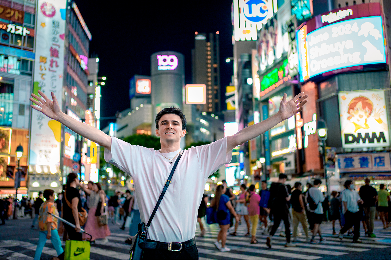 Street portrait of a man on the Shibuya Crossing by night