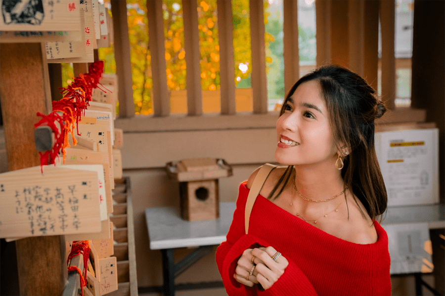 Candid portrait of a woman in Togo Shrine's traditional Japanese atmosphere