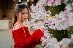 Candid portrait of a woman in Togo Shrine's zen atmosphere