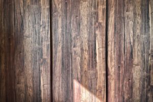 Wooden Panels A detailed shot of wooden panels with natural light highlighting the wood grain texture.