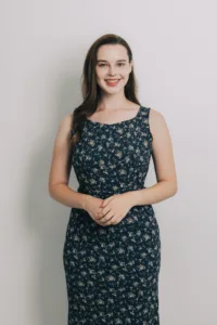 Full-length portrait of model Liza in a blue floral dress at Tokyo photo studio.