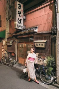 A woman in traditional yukata walking in Asakusa, Tokyo, showcasing lifestyle and cultural photography by JG Studio.