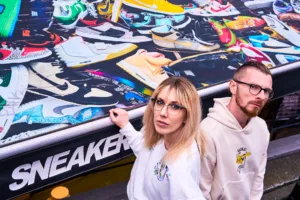 A couple in front of a colorful sneaker shop in Harajuku, Tokyo.