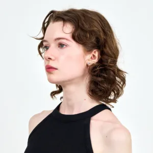 Model Holeckova posing in a black cropped top during a professional photo shoot at JG Studio Tokyo, ideal for portfolio and fashion photography.