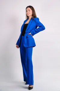 A professional woman in a bright blue business suit poses for a corporate headshot in Tokyo, ideal for LinkedIn and personal branding.