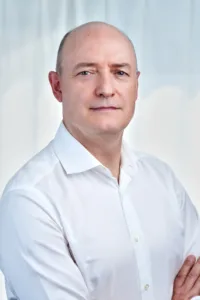 Corporate Headshot for a Businessman A corporate portrait of a businessman in a white shirt, taken in a professional photography studio in Tokyo.