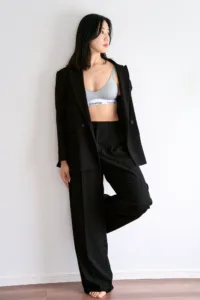 Editorial portrait of a female model in an oversized black suit, shot by JG at his Shibuya studio in Tokyo.