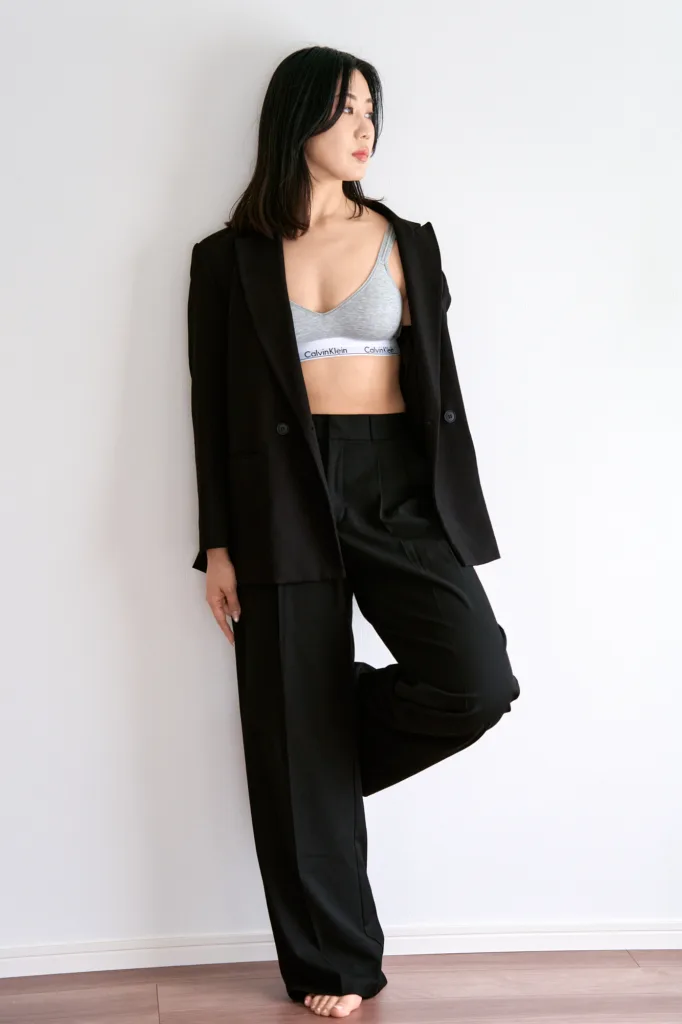 Model Rioka in an oversized black suit, JG Studio, Shibuya.
